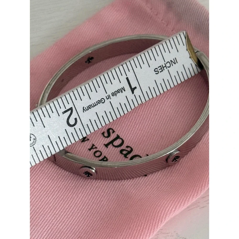 Kate Spade New York Silver Tone Spade Logo Hinged Bangle Bracelet with Dust Bag